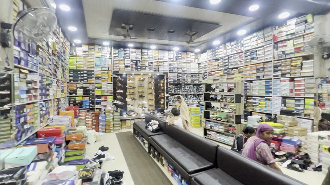 A hall of shelving stacked with shoeboxes