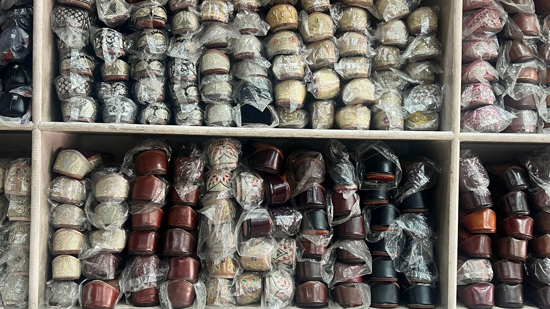 A wall of embroidered and tilla-worked Punjabi juttis